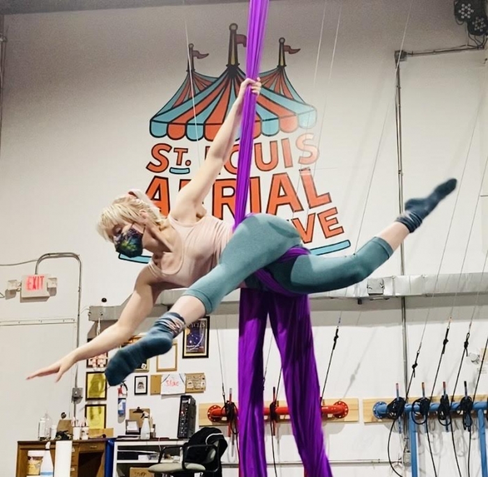 An aerialist doing silks